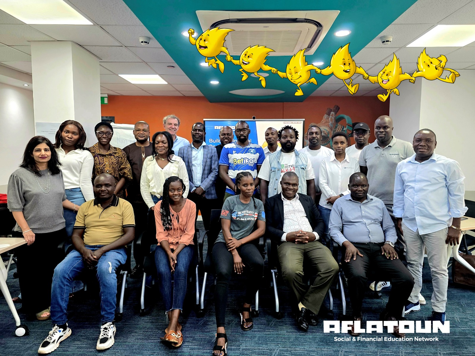 Participants of an Aflatoun social and financial education training pose together